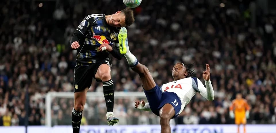 Goalkeeper and player in mid-air collision during match